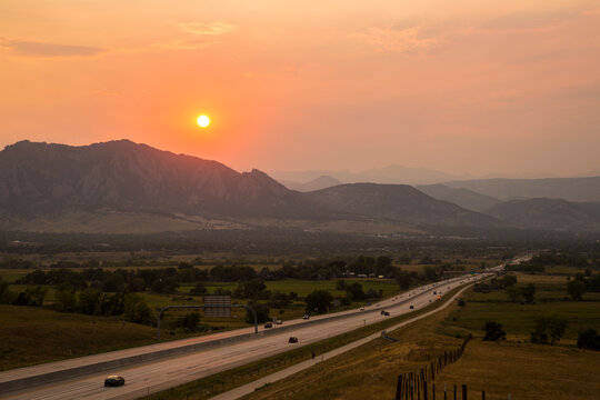 A red sunset in Colorado covered up by forest fire smoke, as seen just outside of Boulder.