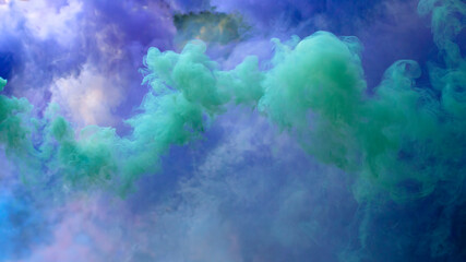 Colored creeping smoke. Blurred background.