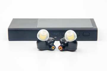 In-ear headphones for Hi-Fi music player. Audio sound and modern equipment for music lovers and...