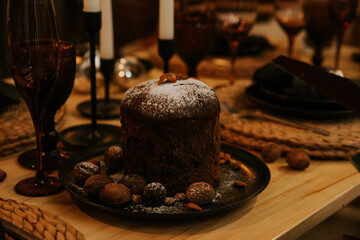Christmas table with a pudding and candles