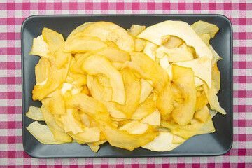 slices of dried melon on a plate. fruits and vitamins. Healthy food.
