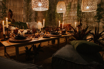 Christmas table with candles, glasses and decorations