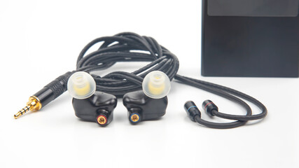 In-ear headphones for Hi-Fi music player. Audio sound and modern equipment for music lovers and...