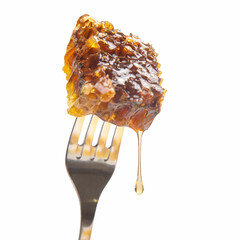 Drops of fresh honey drip from wax honey on a table fork. vitamin nutrition and bee product.