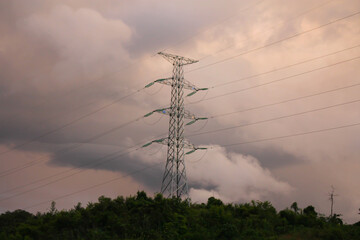 High voltage pole of china on mountain in evening when sunset