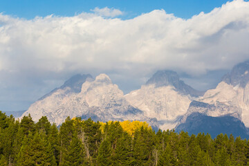 Landscape view of clouds passing over the Grand Teton mountain range in Grand Teton National Park (Wyoming).