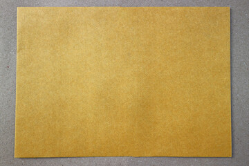 Yellow crate paper texture on a gray paper background for background.