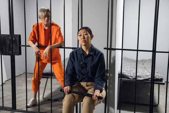 A normal day in a women's prison, a female warden is on guard for a female criminal.