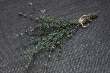 a bunch of thyme from the garden on a dark background