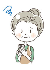 スマホを持っている中年女性・困っている