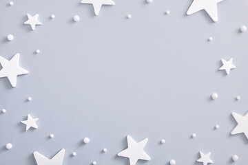 White star and snowball over pastel blue background