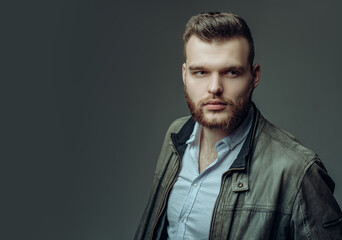 Obraz premium Sexy man isolated on grey background isolated. Fashion male model.