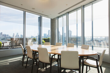 Round table in sunny highrise business conference room