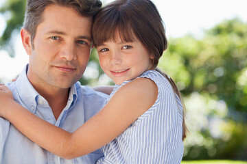 Fototapeta premium Portrait affectionate father and daughter hugging