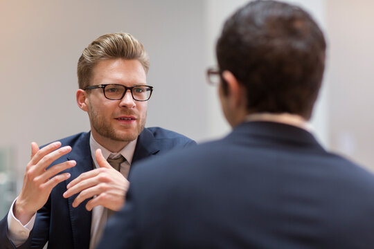 Corporate businessmen talking in meeting