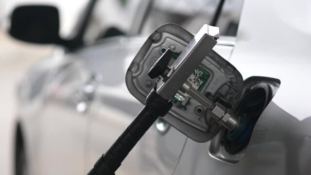 Fuel up the natural gas vehicle (NGV) at the station.