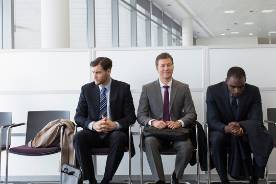 Businessmen waiting for job interview in office lobby