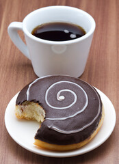 classic donut with coffee isolated on table background