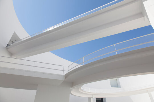 Elevated walkways in sunny modern courtyard