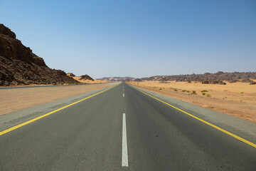 Fototapeta na wymiar Desert road in remote rural area of Tabuk in north western Saudi Arabia