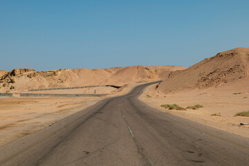 Desert road in remote rural area of Tabuk in north western Saudi Arabia