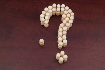 Question and answers of people and society concept. Many people shaped as question mark, they have question, one figure stand alone, he knows answer.