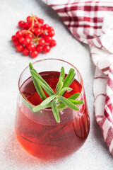Drink from the berries of red viburnum in glass Cup. Berry compote with vitamin C against the common cold.
