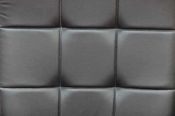Black leather sofa texture of padding cushion. can be use as background