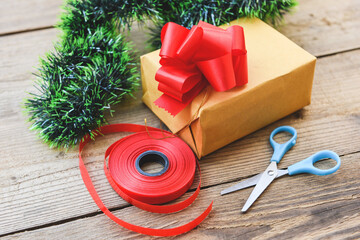 diy gift concept Homemade wrapped christmas presents with tools and decorations on wooden , DIY...