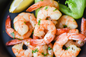 Salad shrimp grilled delicious seasoning spices on bowl appetizing cooked shrimps baked prawns Seafood shelfish with lemon and lettuce
