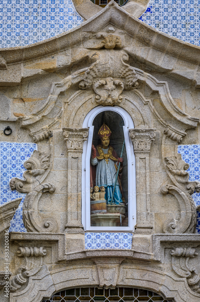 Wall mural details of facade statue of saint nicholas at parish church of st. nicholas or igreja de sao nicolau