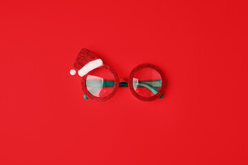 Google glasses Santa's Christmas on red background. Masquerade festive party new year funny...