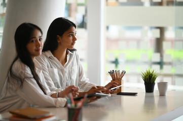Obraz premium Creative workers architect and designer planing together with tablet in office.