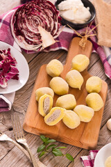 Potato gnocchi stuffed with radicchio and ricotta.