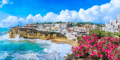 Fotobehang Carvoeiro town with colorful houses and yellow sand beach in Algarve, Portugal © Serenity-H