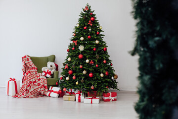 Christmas tree with gifts pine new year decor interior of the house postcard