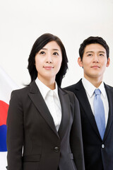 businessman and businesswoman in front of Korean flag, Taegeukgi