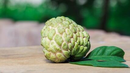 Annona squamosa or sugar-apple on  wooden background