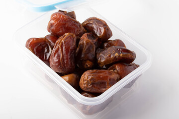 date palm dried in a clear plastic box