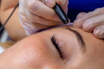 depilation of hair on a person's face, close-up.
