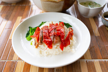 Roasted duck on rice.
