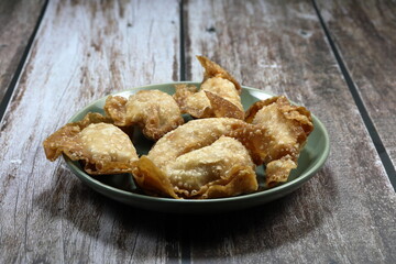 Deep fried wonton (Tofu sheet wrapped with marinated pork) on the plate. Famous dim sum menu in Chinese restaurant. 