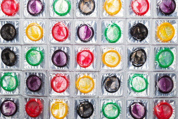 Colorful condoms background.