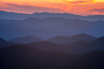 Fototapeta na wymiar Blue Ridge Mountains at sunset seen from the Cowee Mountain Overlook