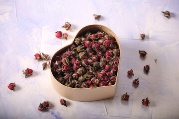 dry rosebuds for tea are on the table