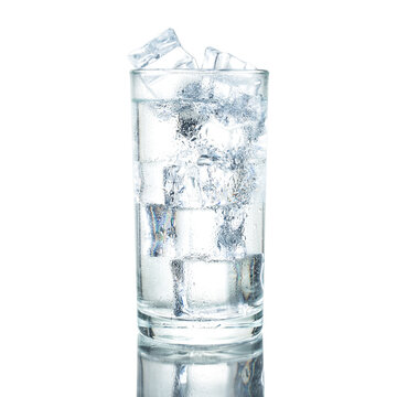 cold water with ice on glass isolated white background