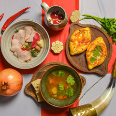 Traditional Georgian food on a National Georgia flag background. Top view, flat lay concept, menu concept.