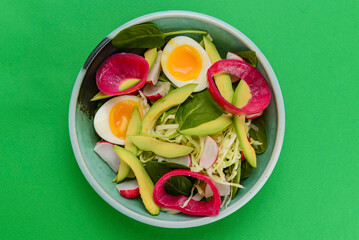 Appetizing salad with eggs and vegetables. Traditional Ukrainian cuisine concept, served in a bowl.