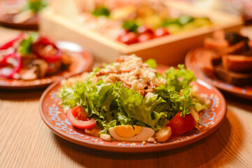 Covered table with traditional Ukrainian food. Ukrainian cuisine, Ukraine concept. Holiday celebration, birthday party.