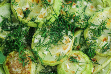Obraz premium Fried zucchinis Sliced with dill and garlic.